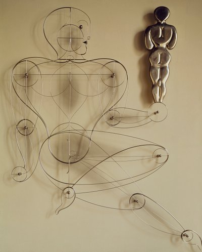 Homo, druciana figurka z figurką z tyłu w ręku autorstwa Oskar Schlemmer