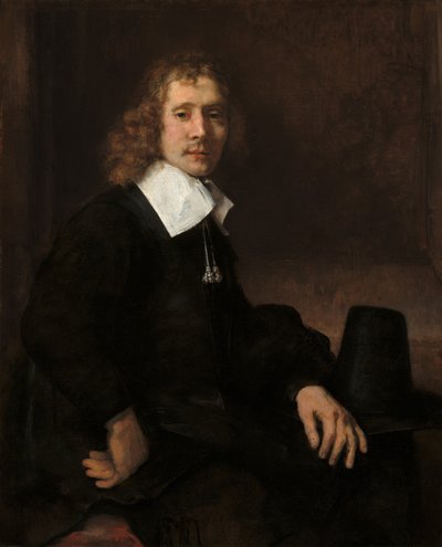 Młody mężczyzna siedzący przy stole, prawdopodobnie Govaert Flinck, ok. 1930 r. 1660. autorstwa Rembrandt van Rijn