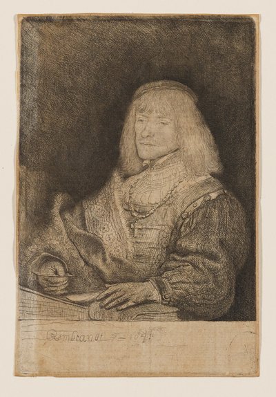 Mężczyzna przy biurku, noszący krzyż na łańcuszku autorstwa Rembrandt van Rijn