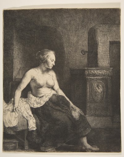 Kobieta siedząca na wpół ubrana obok pieca, 1658. autorstwa Rembrandt van Rijn