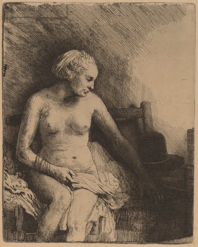 Kobieta w wannie z kapeluszem obok niej autorstwa Rembrandt van Rijn