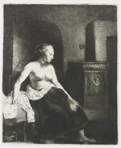 Kobieta siedzi na wpół ubrana obok pieca autorstwa Rembrandt van Rijn