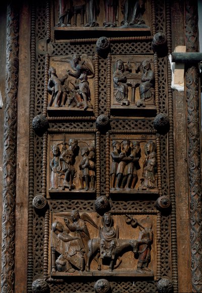 Sztuka romańska: drewniane drzwi z połowy XII wieku kościoła Mariackiego Kapitolu w Kolonii, Niemcy (Sankt Maria im Kapitol, Koln). Sceny przedstawiające zapowiedź pasterzom, szopkę, adorację magów i autorstwa Romanesque