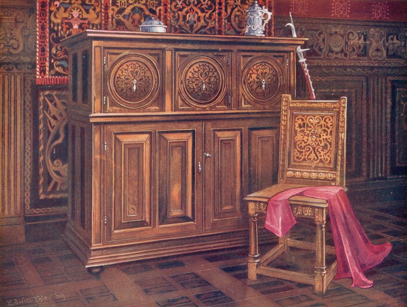 Szafka dębowa z okrągłymi wypukłymi panelami, ornamentem w kształcie arabeski. Krzesło orzechowe z ornamentem z przeplotem autorstwa Edwin John Foley