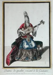 Pani grająca na gitarze