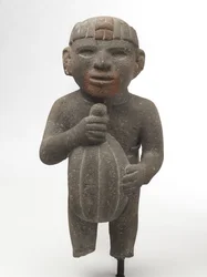 Mężczyzna niosący strąk kakao, 1440-1521 (kamień wulkaniczny ze śladami czerwonego pigmentu)