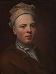 Portret młodego mężczyzny w białej czapce