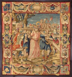 Chrystus i Szymon z Cyreny (Cyrenejczyk). (Piąty przystanek Drogi Krzyżowej (niesienie krzyża). Na fragmencie krzyża widnieje napis I.N.R.I. (INRI). Gobelin wykonany w manufakturze w Brukseli. XVI wiek Genes, Musei di Strada Nuova