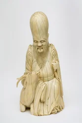 Rzeźbiona figurka Shou Xing siedzącego z jeleniem z kości słoniowej, ok. 1580-1644