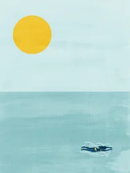 Pływak w słońcu nad oceanem