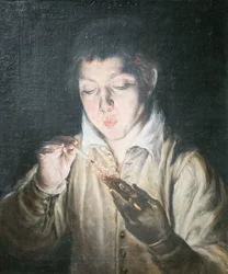 Chłopiec dmuchający żar