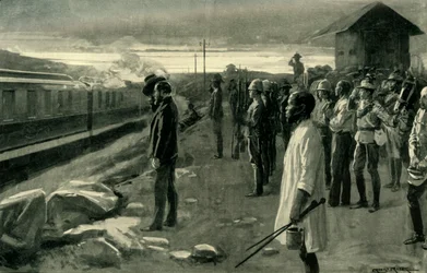 „Pociąg przewożący szczątki pana Rhodesa pozdrawiany przez strażników bloku”, 1902.