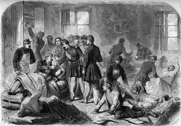 Wizyta cesarza Napoleona III na ranach w bitwie pod Montebello w zaimprowizowanych karetkach pogotowia w Voghera w dniu 21 maja 1859 r. Rycina ze szkicu autorstwa Moullina.