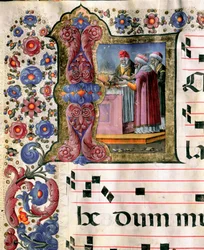Miniaturowa scena poświęcenia autorstwa Girolamo da Cremona (aktywna ok. 1451–1483) z chóru (Cod. 10/L. c. 114v.) z katedry w Sienie. XV-wieczna katedra (Duomo) w Sienie, Włochy