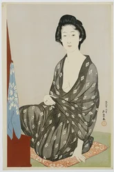 Piękność w czarnym kimonie z białymi wzorami hanabishi, siedząca przed lustrem, 1920