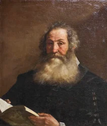 Portret starszego mężczyzny trzymającego książkę