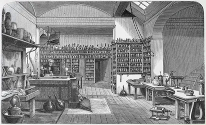 Michael Faraday (1791-1867) w swoim laboratorium w piwnicy, z książki Henry
