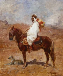 Arab na koniu w pustynnym krajobrazie