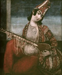 Młoda kobieta grająca na gitarze