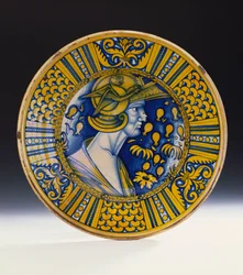 Naczynie portretowe Deruta z połyskiem, malowane na niebiesko i z połyskiem na żółto, przedstawiające wojownika w hełmie ze skrzydlatym gryfem, ok. 1525 r.
