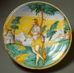 Flecista w pejzażu. Ceramiczny talerz wykonany w Viterbo, Włochy. Koniec XVI wieku, Florencja, Museo Nazionale del Bargello