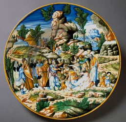 Mojżesz wydobywa wodę ze skały i daje pić ludowi Izraela. Ceramiczny talerz wykonany w Urbino w warsztacie Fontana, Włochy. Około 1560, Florencja, Museo Nazionale del Bargello