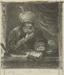 Mężczyzna w turbanie za stołem do pisania