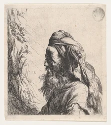 Mężczyzna w turbanie zwrócony w lewo