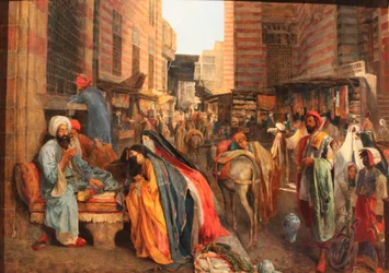 Francuski: La Rue et la mosquée al-Ghouri au Caire Scena uliczna w pobliżu meczetu El Ghouri w Kairze