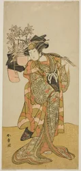 Aktor Yamashita Kinsaku II jako Odai, sprzedawca Eboshi (kapeluszy) w sztuce Hana-zumo Genji Hiiki, wystawiony w Teatrze Nakamura w jedenastym miesiącu, 1775