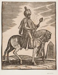 Odziany w turban jeździec z mieczem po prawej stronie i maczugą bojową w lewej ręce, profil w prawo; w tle obelisk