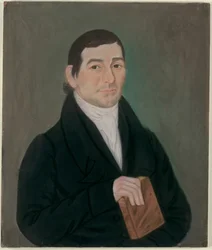 Portret mężczyzny trzymającego książkę