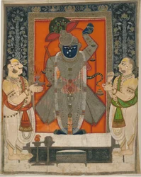 Kapłani czczący Krysznę jako Shrinathji na festiwal Mountain of Food [Annakuta utsava]; wiszące kapliczki [pichhavai]