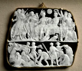 Sztuka rzymska: kamea z onyksu wykonana przez rzeźbiarza Dioscuride (lub Dioscorides) na dwóch poziomach. Na szczycie cesarz August (63 p.n.e.-14 n.e.), otoczony mitologicznymi bogami, wita swojego następcę Tyberę (42 p.n.e. - 37 n.e.). Od lewej do prawej 