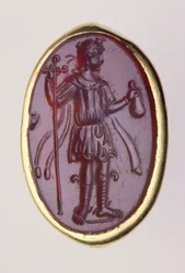 Intaglio oprawiony w złoty pierścionek przedstawiający młodą postać męską, II wiek p.n.e. (złoto i sard)