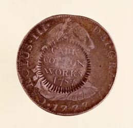 Srebrna moneta (8 reali) z Hiszpanii: panowanie Karola III (1759-1788). 1777 z kontrasygnatem z 1787 r. Śr. 3,9 cm Neapol, muzeum archeologiczne