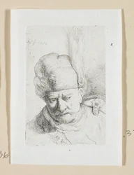 Głowa mężczyzny w turbanie ozdobiona piórkiem