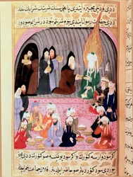 Prorok Muhammad (Muhammad lub Muhammad) (570-632) (zakryta twarz) w podróży do Syrii jest witany przez chrześcijańskich mnichów, którzy podają mu turecką miniaturę posiłku z XVIII wieku. Muzeum Topkapi, Stambuł, Turcja