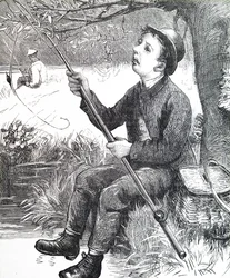 Młody chłopak łowiący ryby