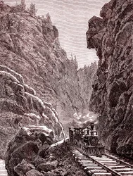 Pociąg przejeżdżający przez góry Kolorado. USA w 1886 r. (rycina)