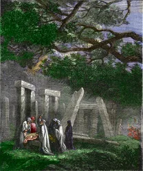 Druidzi praktykujący składanie ofiar z ludzi w Stonehenge zatrzymane przez rzymskich żołnierzy - Ofiary z ludzi przez druidów a Stonehenge zatrzymują się w Stonehenge przez rzymskich żołnierzy podczas rytuału - Kolorowa grawerunek z XIX wieku
