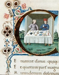 Zdobiony inicjał C z parą przy stole. Miniatura z „Bukolik” (Eklog) Wergiliusza (Publius Vergilius Maro) (70-19 p.n.e.) (rkps IV E.12) - XV wiek, Neapol, Biblioteca Nazionale