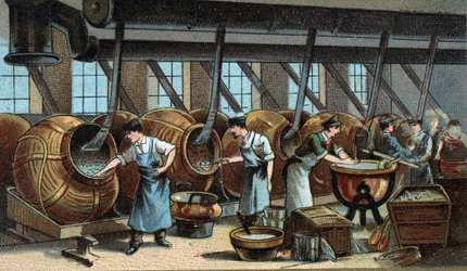 Produkcja mechaniczna drażetek. Chromolitografia z końca XIX wieku