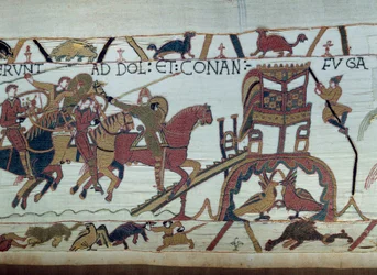 Arme Wilhelma Zdobywcy (1027-1087) wyruszyły do walki z księciem Bretanii, przybyły do Bayeux. Harold właśnie został pasowany na rycerza przez Guillaume Detal gobelinu z Bayeux lub haftu królowej Matyldy
