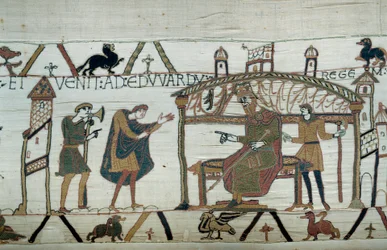 Harold, który wrócił do Anglii, po swojej ambasadzie u księcia Wilhelma Zdobywcy (1027-1087), wyrecytował swoją podróż do króla Edwarda Wyznawcy Detal gobelinu z Bayeux lub haftu królowej Matyldy