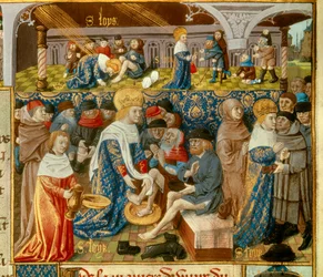 Król Ludwik IX (1214-1270) (Saint Louis) myjący stopy ubogim i sceny chrześcijańskiej dobroczynności z Miniatury Króla zaczerpniętej z rękopisu „Księga faktów prałata św. Ludwika””” XV wiek. Paryż, B.N