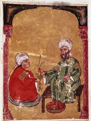 Lekarz i botanik Pedanius Dioscoride (Pedanius Dioscorides) (40-90 ne) siedzący z jednym ze swoich uczniów Miniatura z jego traktatu „De materia medica” (ms Ahmed III, 2147, folio 217a) 1229 Biblioteka Muzeum Topkapi Sarayi, Stambuł