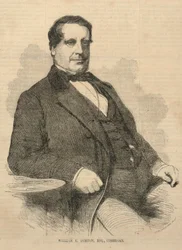 William E. Burton, Esq., komik, z Ballou